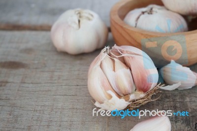 Garlic On Wooden Stock Photo