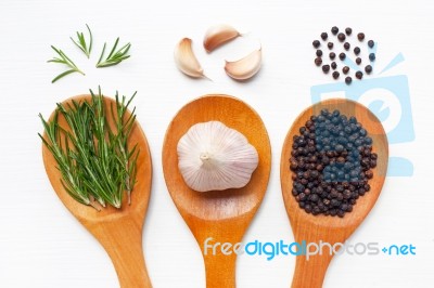 Garlic With Rosemary And Black Peppercorn White Stock Photo