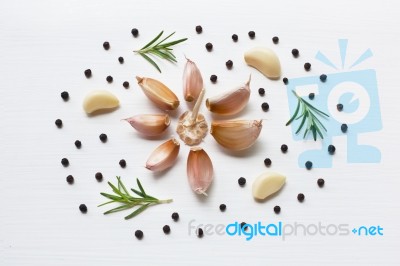 Garlic With Rosemary And Peppercorn Isolated On White Background… Stock Photo