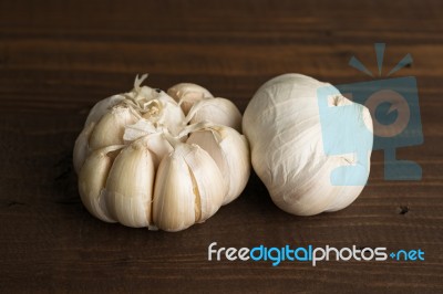 Garlics Close Up On Table Wood Vintage Background Stock Photo