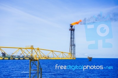 Gas Flare Is Releasing And Burning To The Atmosphere At An Offsh… Stock Photo