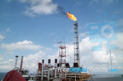 Gas Or Flare Burn On Offshore Platform Stock Photo