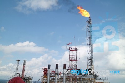 Gas Or Flare Burn On Offshore Platform Stock Photo