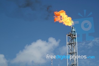 Gas Or Flare Burn On Offshore Platform Stock Photo