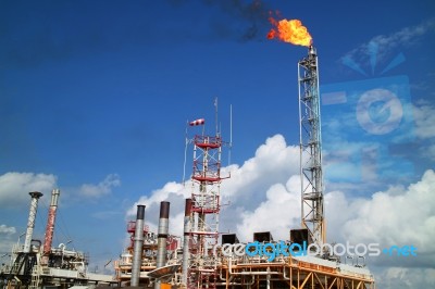 Gas Or Flare Burn On Offshore Platform Of Oil And Gas Industry Stock Photo