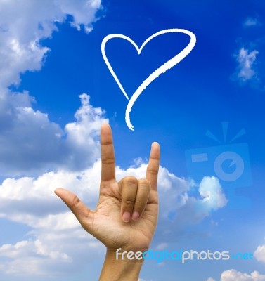 Gesturing Hand On Blue Sky Stock Image