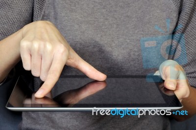 Gesturing On The Digital Tablet Stock Photo