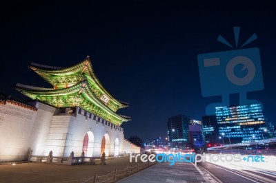 Geyongbokgung Palace And Car Light At Night In Seoul, South Korea Stock Photo