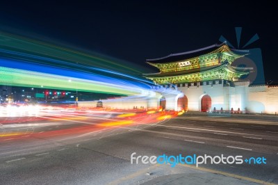 Geyongbokgung Palace And Car Light At Night In Seoul, South Korea Stock Photo