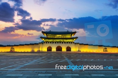 Geyongbokgung Palace And Car Light At Sunset In Seoul, South Korea Stock Photo