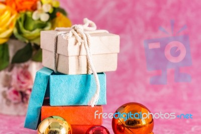 Gift And Balls On A Background Stock Photo