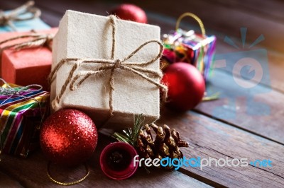 Gift And Balls On A Wooden Stock Photo