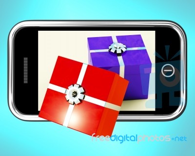 Gift Boxes On Mobile Screen Stock Image