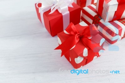 Gift Boxes On White Wood Table Stock Photo