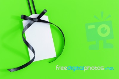 Gift Tag On Green Background Stock Photo