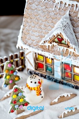 Gingerbread House And Snowman Stock Photo