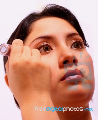 Girl Applying Cosmetics To Face Stock Photo