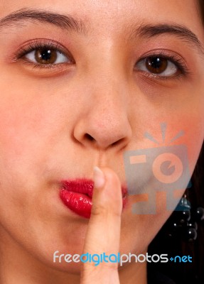 Girl Asking Us To Be Quiet Stock Photo