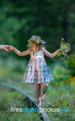 Girl Balancing On Rails Stock Photo