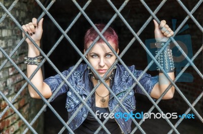 Girl Behind Bars Stock Photo