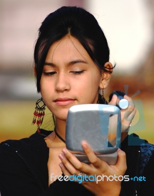 Girl Checking Her Make Up In Mirror Stock Photo