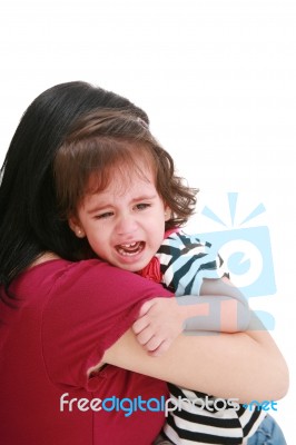 Girl Crying In Mothers Arm Stock Photo