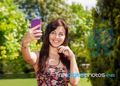 Girl Doing Selfie Mobile Phone In Park Stock Photo