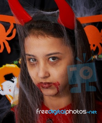 Girl Dressed Up As Devil Stock Photo