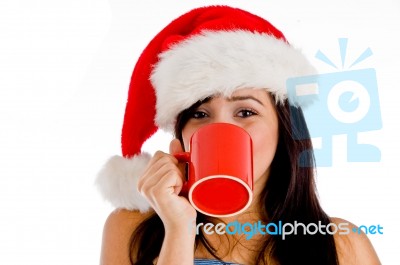 Girl Drinking Coffee Wearing Christmas Hat Stock Photo