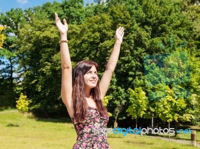 Girl Enjoing Sunny Skies In The Park Stock Photo