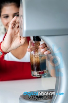 Girl Filling Glass With Chocolate Shake Stock Photo