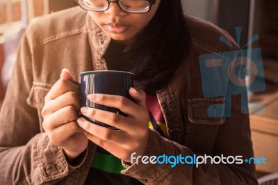 Girl Holding A Coffee At Work Stock Photo