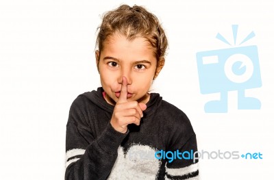 Girl Holding Index Finger Around The Mouth. A Gesture Of Silence . Closeup-isolated On White Background Stock Photo