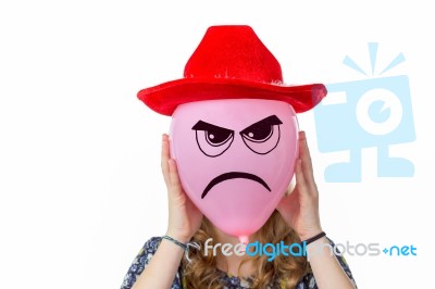 Girl Holding Pink Balloon With Angry Face And Red Hat Stock Photo