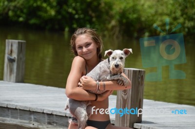 Girl Holding Schnauzer Stock Photo