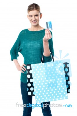 Girl Holding Shopping Bags And Credit Card Stock Photo