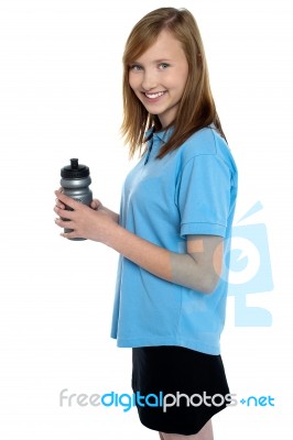 Girl Holding Sipper Bottle. Break From Gym Workout Stock Photo