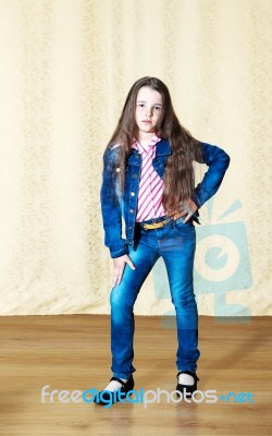 Girl In A Blue Denim Suit Stock Photo