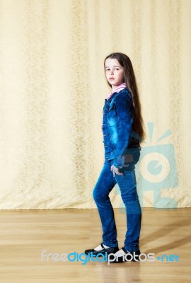 Girl In A Blue Denim Suit In Studio Stock Photo