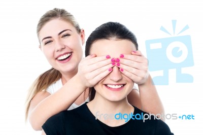 Girl In Playful Mood Teasing Her Friend Stock Photo