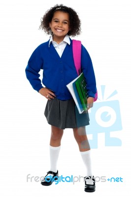 Girl In Smart Uniform Holding Notebook And Calculator Stock Photo