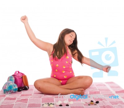 Girl In Swimsuit At The Beach Relaxing Stock Photo