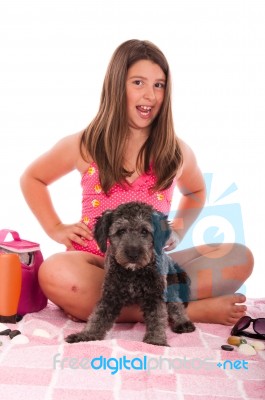 Girl In Swimsuit At The Beach With Dog Stock Photo