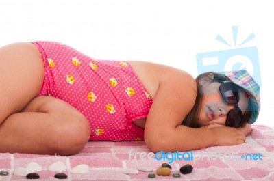 Girl In Swimsuit Sleeping At The Beach Stock Photo