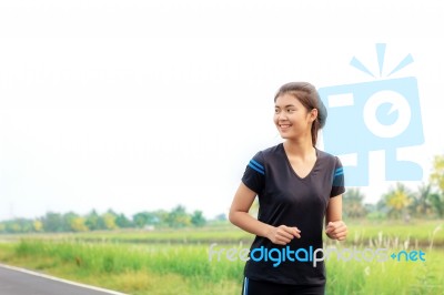 Girl Is Jogging With Sky Stock Photo