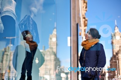 Girl Is Looking At Shop Window Stock Photo