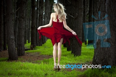 Girl Jumping In Forest Stock Photo