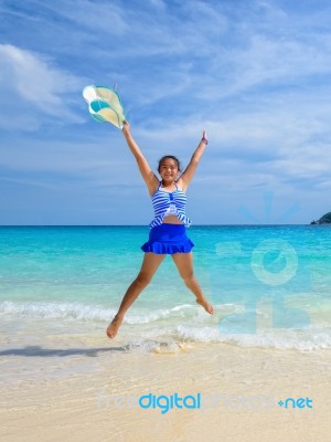 Girl Jumping With Happy On The Beach At Thailand Stock Photo