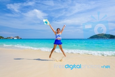 Girl Jumping With Happy On The Beach At Thailand Stock Photo