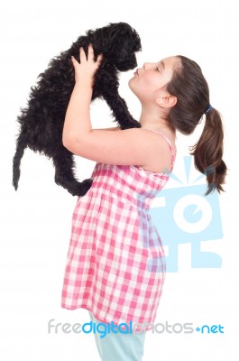 Girl Kissing Dog Stock Photo